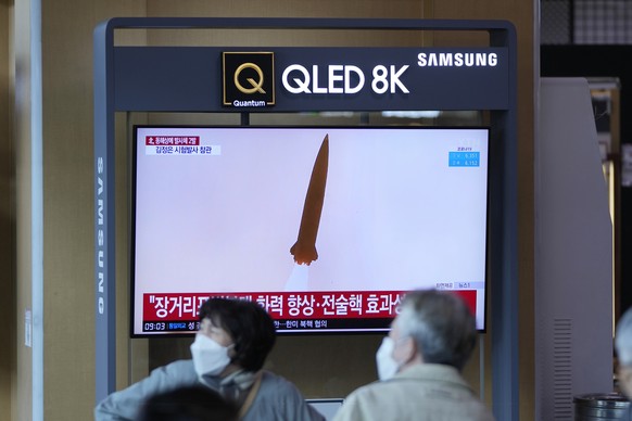 A TV screen shows a news program reporting about a test-firing of a newly developed tactical guided weapon, at a train station in Seoul, South Korea, Sunday, April 17, 2022. North Korea said Sunday it ...