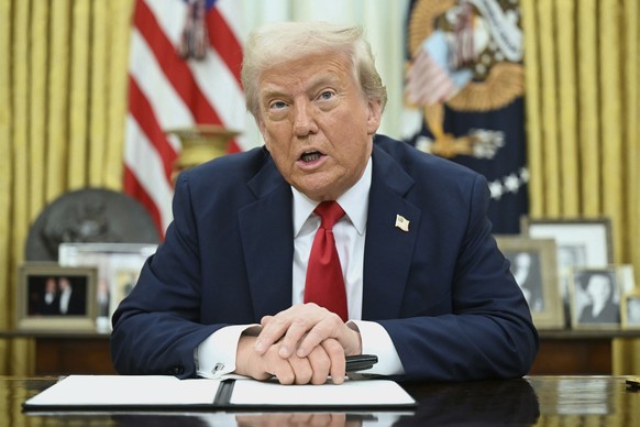 President Donald Trump speaks to reporters before signing an executive order in the Oval Office of the White House in Washington, Monday, March 31, 2025. (Pool via AP)
Trump