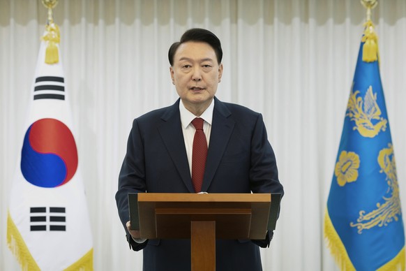 In this photo released by South Korean President Office via Yonhap, South Korean President Yoon Suk Yeol speaks at the presidential residence in Seoul, South Korea, Saturday, Dec. 14, 2024. (South Kor ...