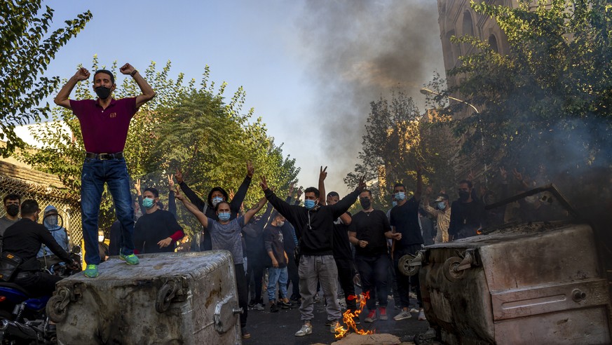 In this photo taken by an individual not employed by the Associated Press and obtained by the AP outside Iran, Iranians protests the death of 22-year-old Mahsa Amini after she was detained by the mora ...