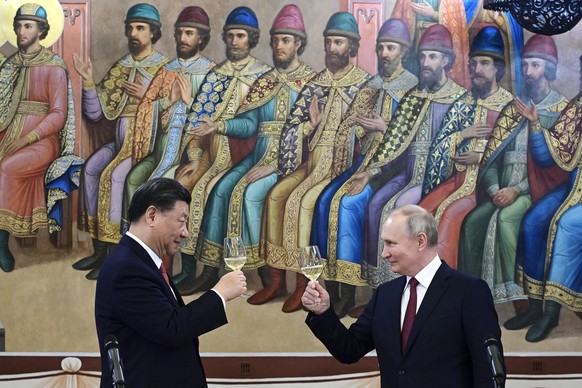 FILE - Russian President Vladimir Putin, right, and Chinese President Xi Jinping toast during their dinner at The Palace of the Facets, a building in the Moscow Kremlin, Russia, on March 21, 2023. The ...