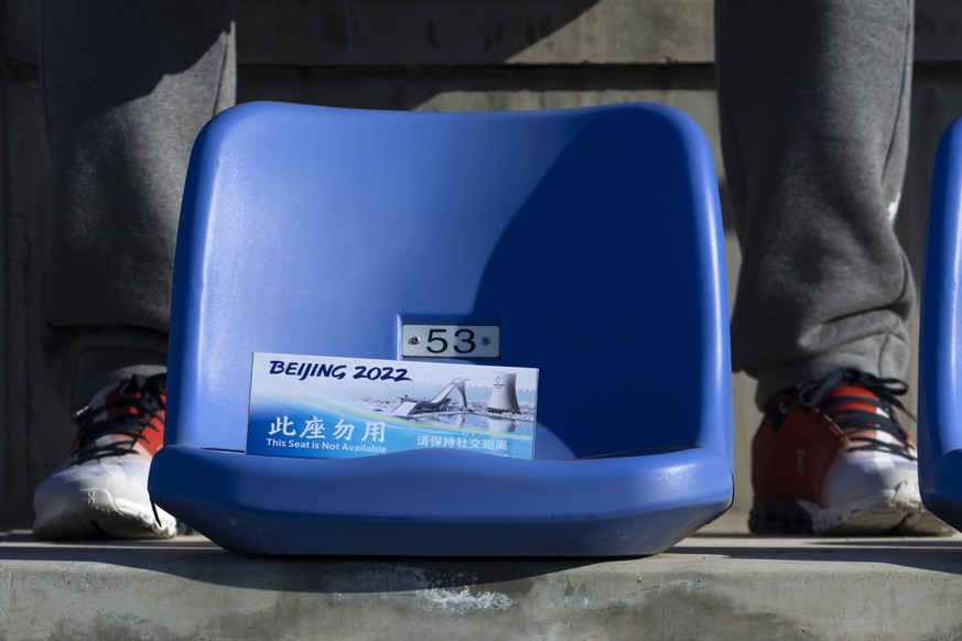 A sign reading &quot;This seats is not available - Keep social distance&quot; displayed on a seat is pictures during the women&#039;s Freestyle Skiing Big Air Final at Big Air Shougang at the 2022 Win ...
