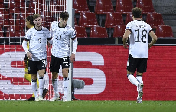 Germany's Kai Havertz, centre, is congratulated by teammate Timo Werner, left, after scoring his team's second goal during the UEFA Nations League soccer match between Germany and Switzerlan ...
