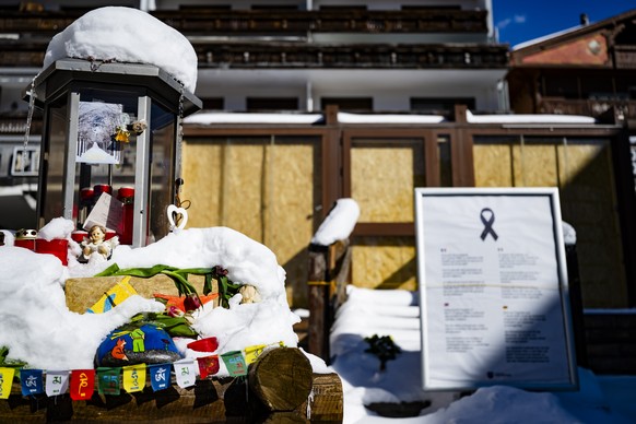 Snow covers the entrance to the "Le Constellation" bar, three months after the tragedy, in Crans-Montana, Switzerland, Wednesday, April 1, 2026. (KEYSTONE/Jean-Christophe Bott)