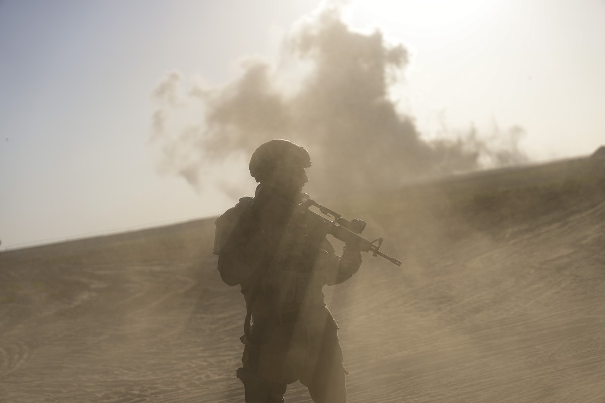 An Israeli soldier stands near the Gaza Strip border in southern Israel, Monday, March 4, 2024. The army is battling Palestinian militants across Gaza in the war ignited by Hamas' Oct. 7 attack i ...