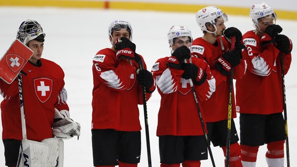 Switzerland&#039;s players stand on ice after the U20 Ice Hockey Worlds quarterfinal match between Switzerland and Russia in Trinec, Czech Republic, Thursday, Jan. 2, 2020. (AP Photo/Petr David Josek)