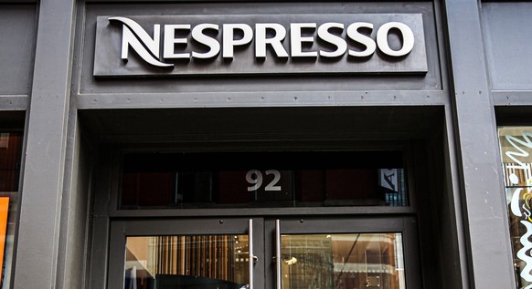 April 10, 2022, New York, New York, USA: Protesters gathered outside of Nespresso on Prince street in SOHO Manhattan in rally against the war in Ukraine. Nestle Group, which owns Nespresso as well as  ...