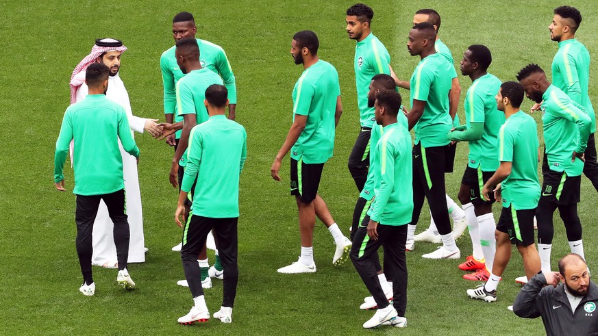 epa06805000 Saudi Arabia&#039;s sports minister Turki al-Sheikh (back L) interrupts the Saudi Arabian national soccer team training session to talk to players in Moscow, Russia, 13 June 2018. Saudi Ar ...