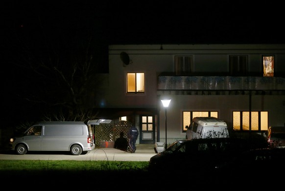 Coffins ans a hearse stand in front of a house where six people were found dead in Boeheimkirchen, Austria, December 1, 2016. REUTERS/Leonhard Foeger