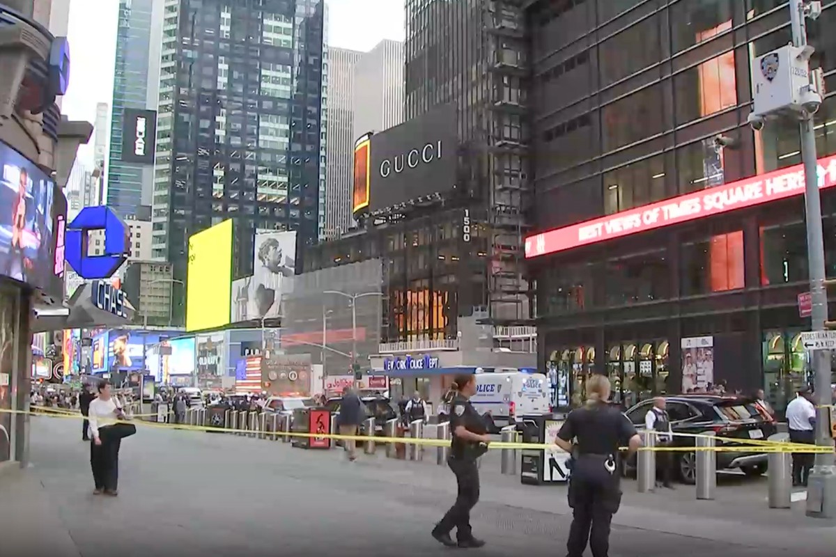 This image made from video provided by WABC-TV shows NYPD officers on the scene after a woman brandishing two large knives was shot by officers in Times Square in New York, Monday, Aug. 31, 2026. (WAB ...