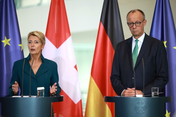 epa12345848 German Chancellor Friedrich Merz (R) and Swiss Federal President Karin Keller-Sutter hold a joint press conference at the Chancellery in Berlin, Germany, 02 September 2025. EPA/CLEMENS BIL ...