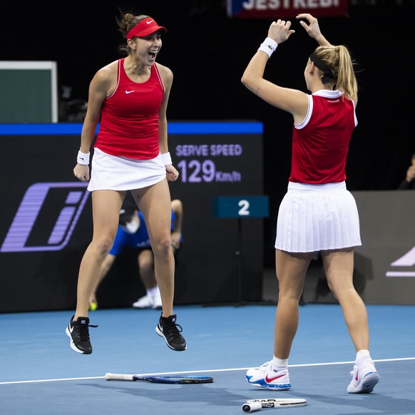 Switzerland&#039;s Belinda Bencic, left, and teammate Jil Teichmann celebrate after winning their group D Billie Jean King Cup finals tennis doubles match against Czech Republic&#039;s Katerina Siniak ...