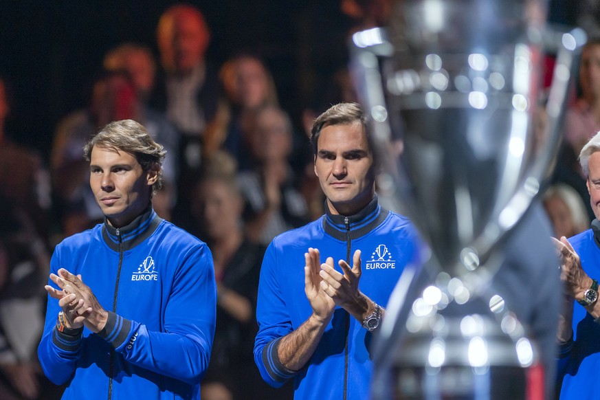 Team Europe's Rafael Nadal, left, and Roger Federer, right, watch the cup during the ceremony at the Laver Cup tennis event, in Geneva, Switzerland, Friday, September 20, 2019. (KEYSTONE/Martial Trezz ...