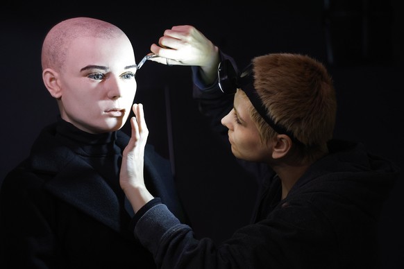 In this undated handout photo provided by The National Wax Museum Plus, Artistic Coordinator Mel Creek applies the finishing touches on a wax figure of the late singer Sinead O&#039;Connor, at the Nat ...