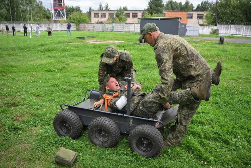 Russia Defence Contract Service Recruitment 9224350 19.08.2026 Men who signed military service contracts with Russia s Defence Ministry attend a tactical medicine training session with ground robotic  ...