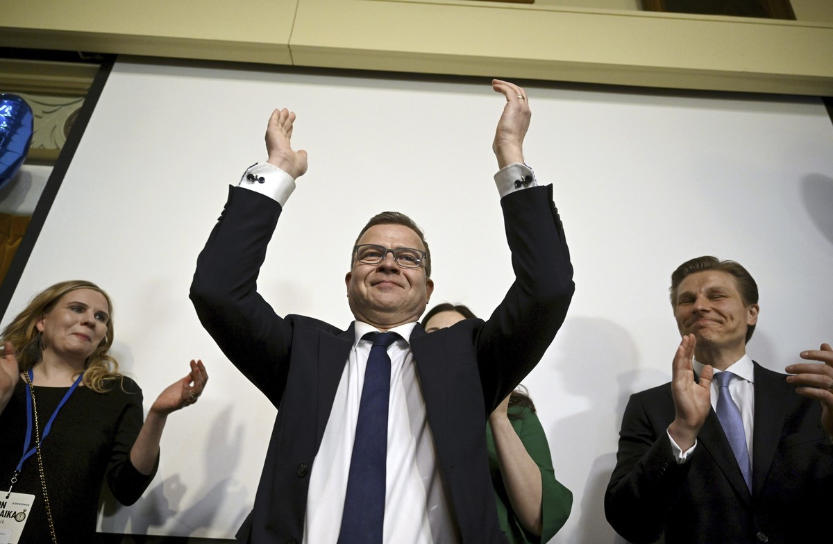 The National Coalition party Chairman Petteri Orpo, center, celebrates at the party's parliament election party at the Ostrobotnia club in Helsinki, Finland on Sunday, April 2, 2023. Finland?s ce ...