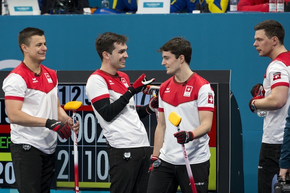 Valentin Tanner, Peter de Cruz, Benoit Schwarz and Claudio Paetz of Switzerland, from left, during the men Curling round robin game between Switzerland and Sweden in the Gangneung Curling Center in Ga ...