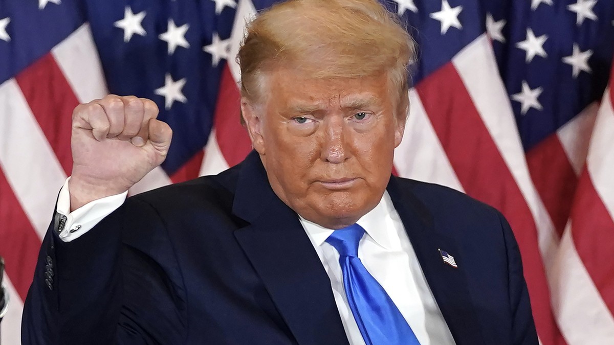 FILE - President Donald Trump pumps his fist after speaking in the East Room of the White House, early Wednesday, Nov. 4, 2020, in Washington. (AP Photo/Evan Vucci)
Donald Trump