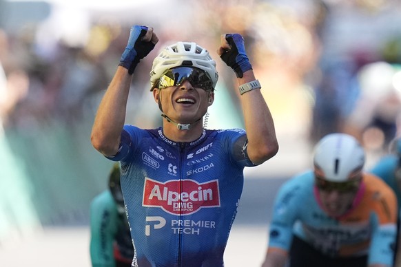 Belgium's Jasper Philipsen crosses the finish line to win the seventeenth stage of the Tour de France cycling race, with start in Chambery and finish in Voiron France, Wednesday, July 22, 2026. ( ...