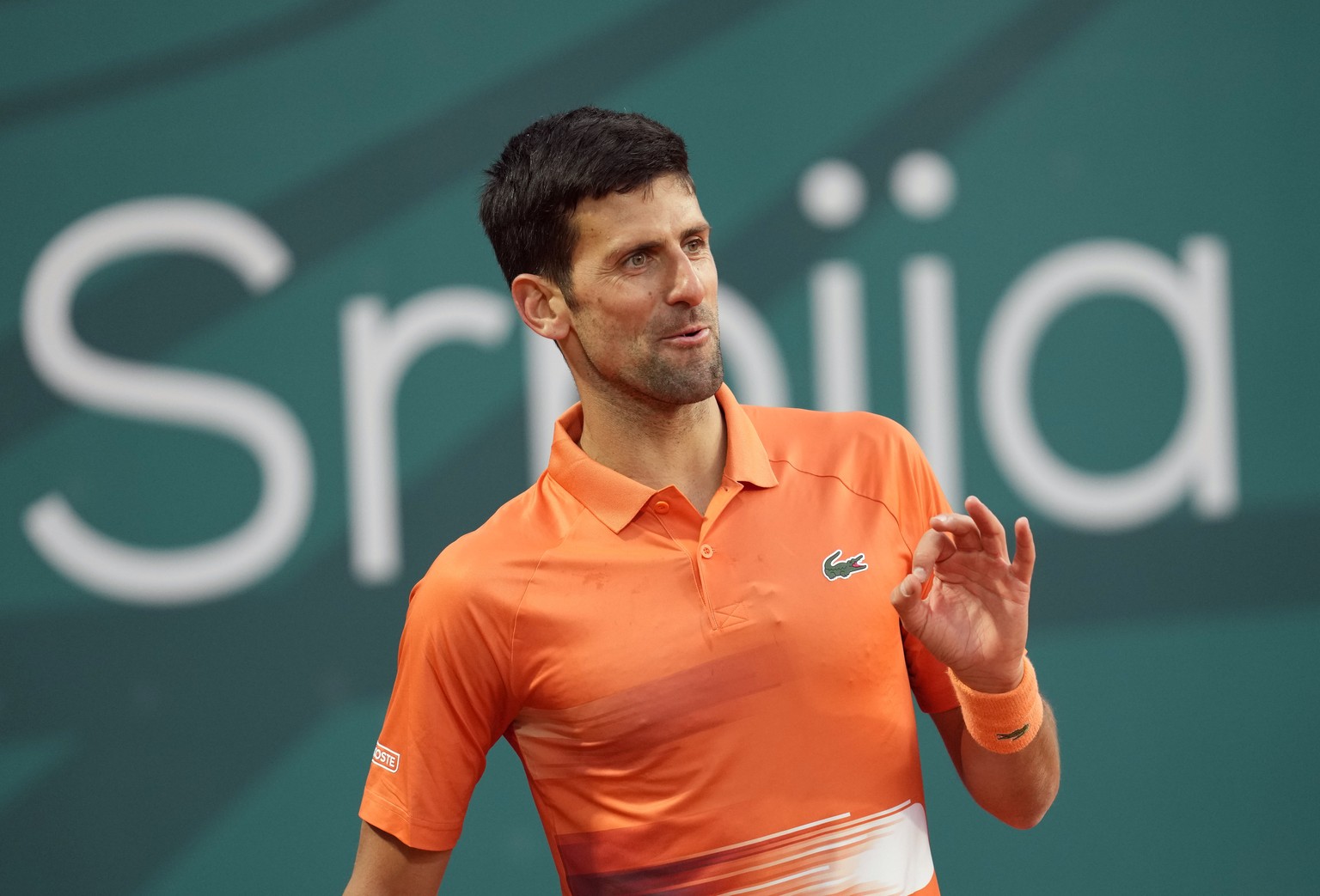 Novak Djokovic of Serbia reacts during their tennis match of the Serbia Open tennis tournament against Laslo Djere of Serbia in Belgrade, Serbia, Wednesday, April 20, 2022. (AP Photo/Darko Vojinovic)