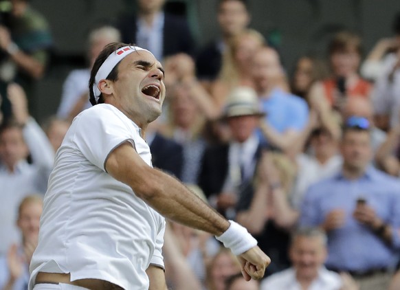 Switzerland&#039;s Roger Federer celebrates defeating Spain&#039;s Rafael Nadal during a men&#039;s singles semifinal match on day eleven of the Wimbledon Tennis Championships in London, Friday, July  ...