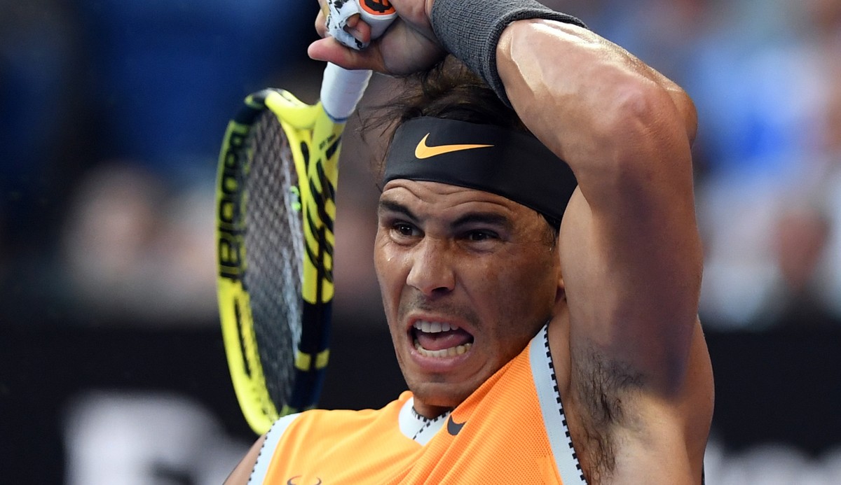 epa07314584 Rafael Nadal of Spain in action against Stefanos Tsitsipas of Greece during the men's singles semi final at the Australian Open tennis tournament in Melbourne, 24 January 2019. EPA/LU ...