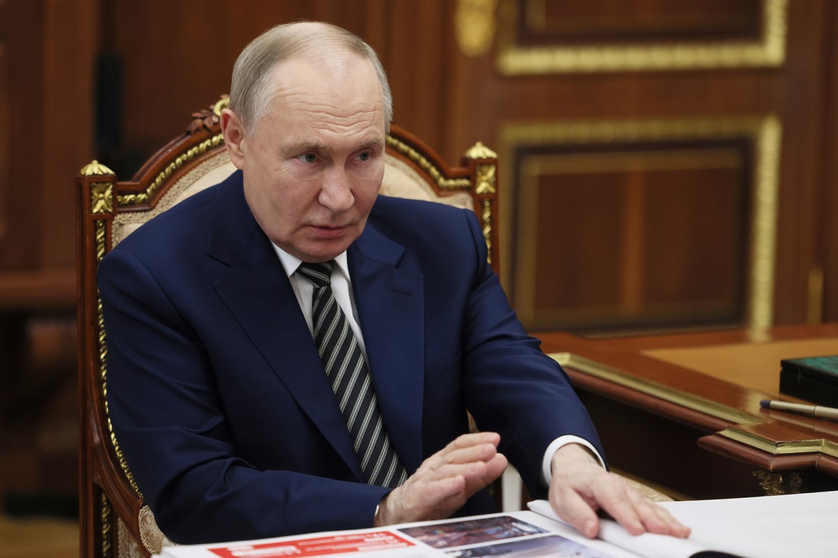 Russian President Vladimir Putin speaks with the governor of Arkhangelsk region Alexander Tsybulsky during their meeting at the Kremlin in Moscow, Russia, Tuesday, March 11, 2025. (Mikhail Metzel, Spu ...