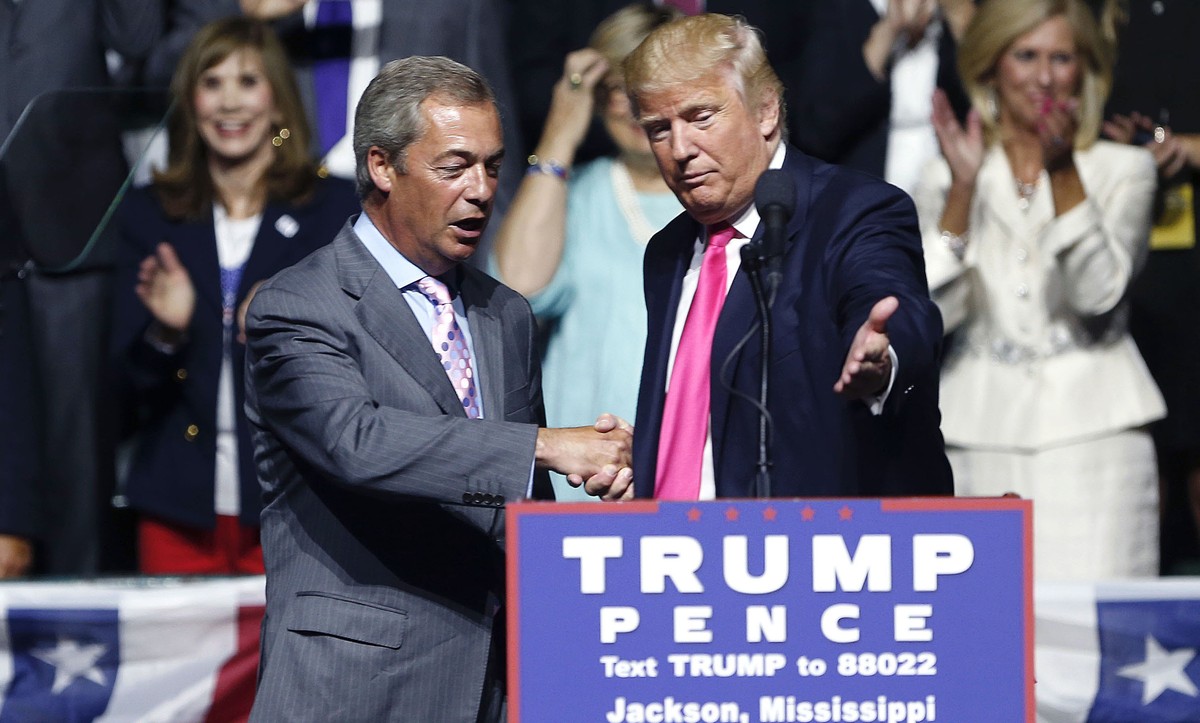 Republican presidential candidate Donald Trump welcomes Nigel Farage, ex-leader of the British UKIP party, to speak at a campaign rally in Jackson, Miss., Wednesday, Aug. 24, 2016. (AP Photo/Gerald He ...