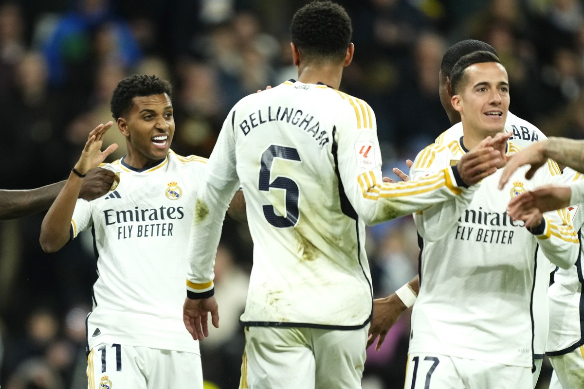 Real Madrid's Rodrygo, left, celebrates after scoring his side's second goal during the Spanish La Liga soccer match between Real Madrid and Granada at the Santiago Bernabeu stadium in Madri ...