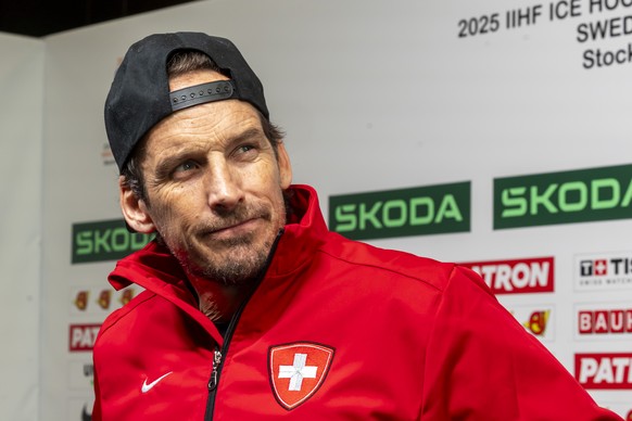 Patrick Fischer, head coach of Switzerland national ice hockey team, speaks with to media in the mixed zone, after a Switzerland training session one day before the IIHF 2025 World Championship quarte ...