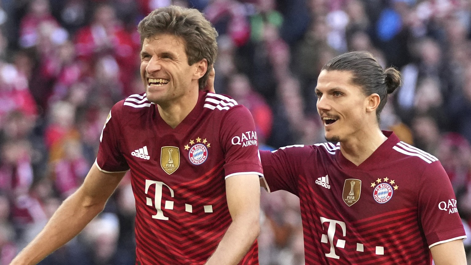 Bayern's Serge Gnabry, left, Bayern's Marcel Sabitzer, right, Bayern's Thomas Mueller, centre, celebrate after Bayern's Robert Lewandowski scored his side's second goal during the German Bundesliga so ...
