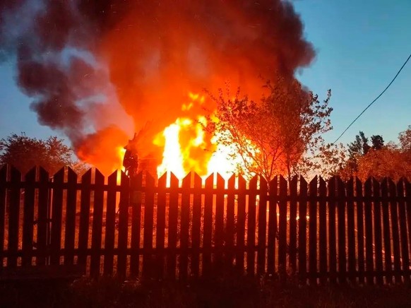 KEYPIX - This photo released by Moscow Region Governor Andrei Vorobyev's official telegram channel shows a house on fire after a Ukrainian attack in Khimki, just outside Moscow, Russia, on Sunday ...