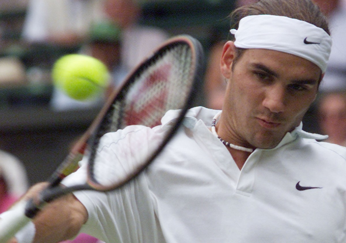 Roger Federer of Switzerland returns to Pete Sampras during their men's singles, fourth round match on the Centre Court at Wimbledon, Monday July 2, 2001.(AP Photo/Dave Caulkin)
