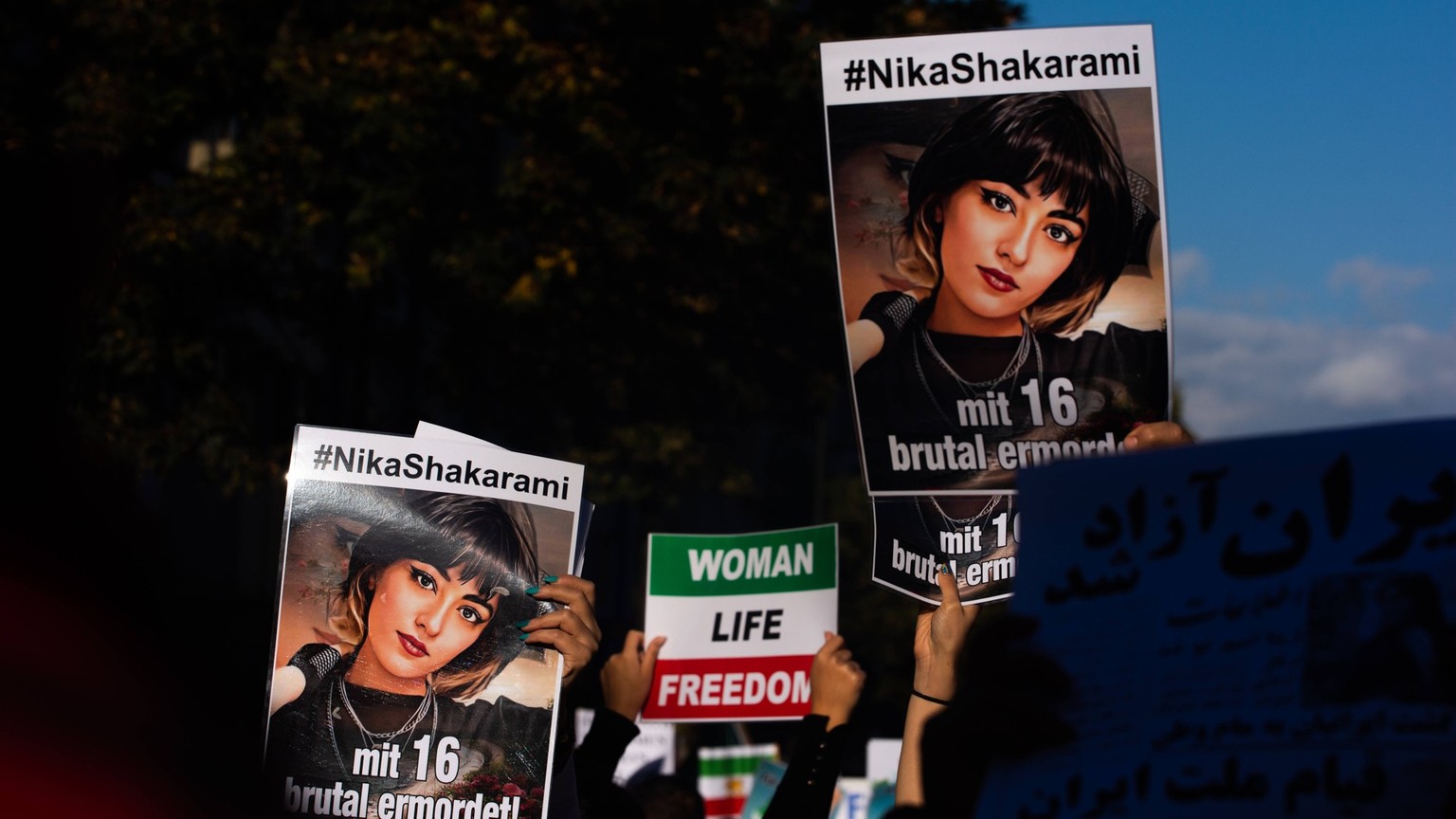 Women Rights Demo In Dusseldorf pictures of Nika Shakarami , a 16 years old Iranian girl was killed during protest, are seen during the women, life, liberty protest in Duesseldorf, Germany on Oct 8, 2 ...