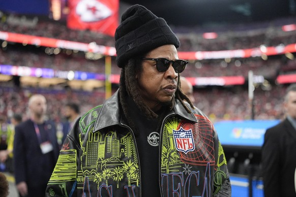 Jay-Z walks on the sidelines before the NFL Super Bowl 58 football game between the San Francisco 49ers and the Kansas City Chiefs, Sunday, Feb. 11, 2024, in Las Vegas. (AP Photo/George Walker IV)