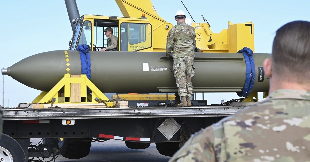 In this photo released by the U.S. Air Force on May 2, 2023, airmen look at a GBU-57, or the Massive Ordnance Penetrator bomb, at Whiteman Air Base in Missouri. That U.S. bomb, designed to destroy und ...
