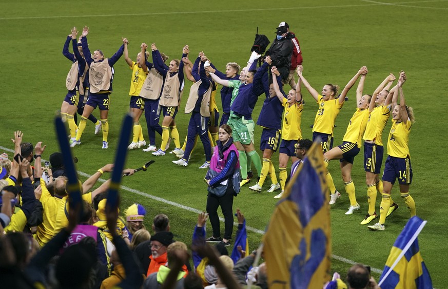 Sweden players celebrate at the end of the Women Euro 2022 quarter final soccer match between Sweden and Belgium at Leigh Sports Village, in Leigh, Manchester, England, Friday, July 22, 2022. (AP Phot ...