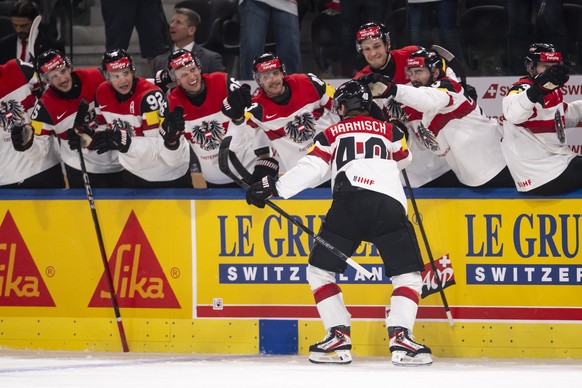 Austria's Tim Harnisch celebrates his goal to make it 0:1 with teammates during the 2026 IIHF Men's Ice Hockey World Championship preliminary round group A game between Latvia and Austria, a ...