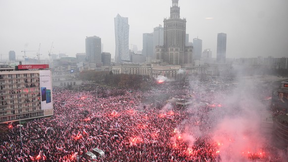 epa07158626 Demonstrator light flares as theye gather in the city center to take part in the National White and Red March &#039;For You Poland&#039; to mark Polish Independence Day in Warsaw, Poland,  ...