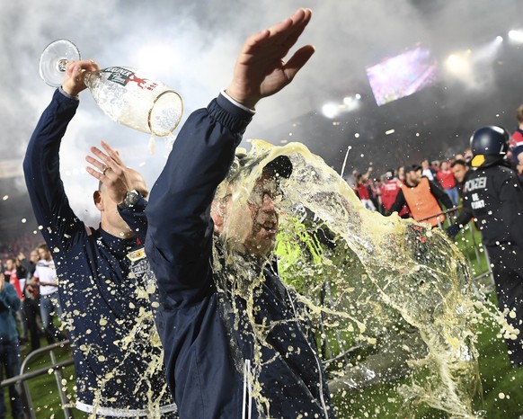 Urs Fischer coach of FC Union Berlin celebrates with fans after the soccer match with VfB Stuttgart in Berlin, Germany, Monday May 27, 2019. FC Union Berlin secured promotion to the Bundesliga. (Joerg ...