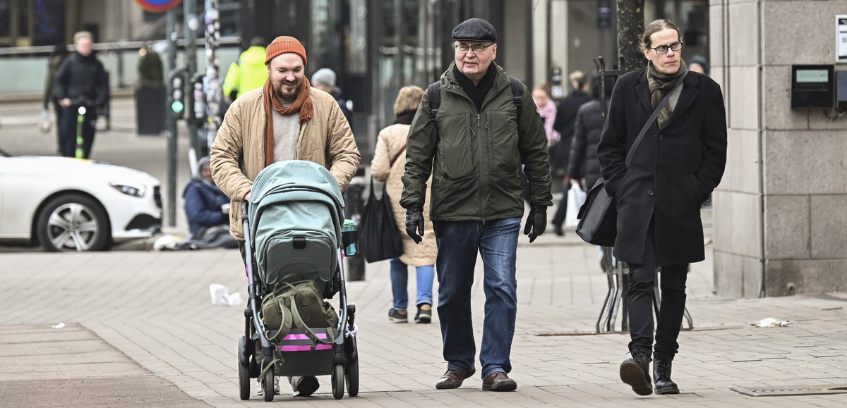 epa12833332 People walk in downtown Helsinki, Finland, 19 March 2026. According to the World Happiness Report 2026, covering 147 countries, Finland has been ranked as the happiest country in the world ...