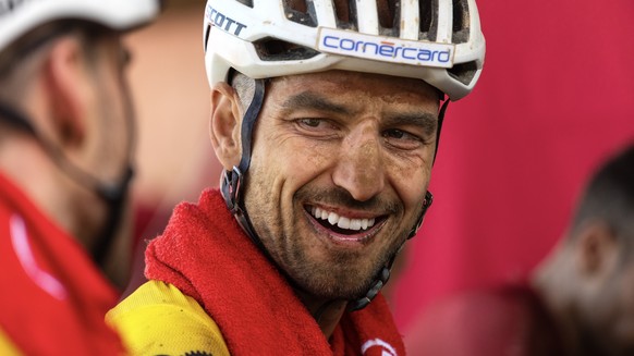epa11227574 Race leader and yellow jersey wearer Nino Schurter from Switzerland reacts after stage 1 of the ABSA Cape Epic MTB race over 88 km with 2540m of climbing in Saronsberg, South Africa, 18 Ma ...