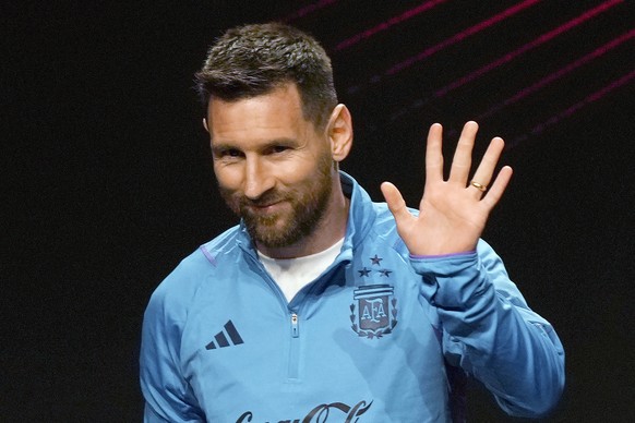 FILE - Argentina soccer star Lionel Messi waves during a ceremony at the CONMEBOL headquarters in Asuncion, Paraguay, Monday, March 27, 2023. Lionel Messi says he is coming to Inter Miami and joining ...