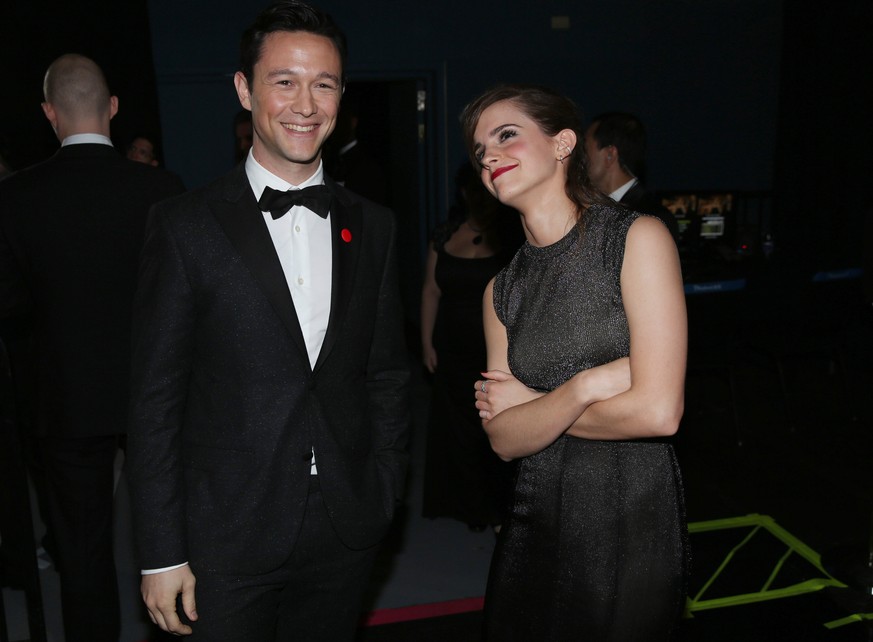 Joseph Gordon-Levitt, left, and Emma Watson stand backstage during the Oscars at the Dolby Theatre on Sunday, March 2, 2014, in Los Angeles. (Photo by Matt Sayles/Invision/AP)