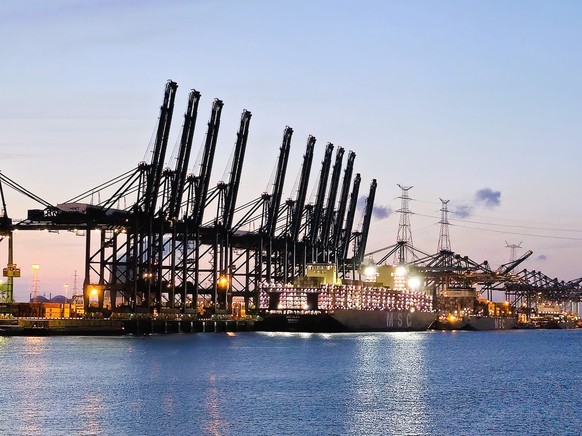 Antwerp, East Flanders, Belgium. 29 May 2025. Image of Port of Antwerp harbor and Scheldt river at night. Port of Antwerp-Bruges.