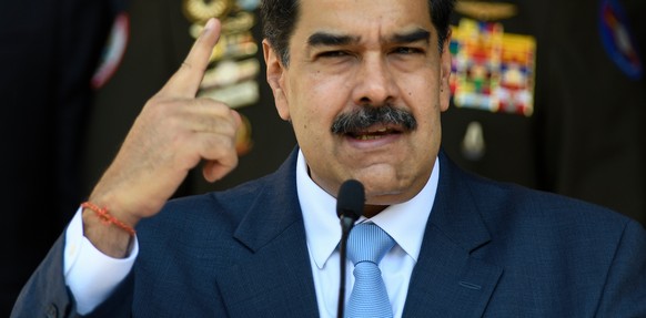 FILE - In this March 12, 2020, file photo, Venezuelan President Nicolas Maduro gives a press conference at the Miraflores presidential palace in Caracas, Venezuela. (AP Photo/Matias Delacroix, File)
M ...