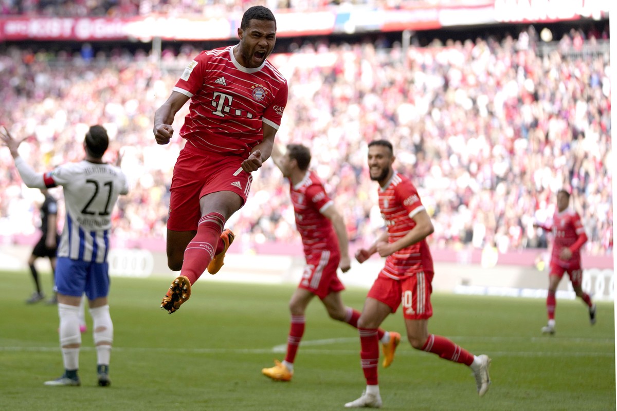 Bayern's Serge Gnabry celebrates after scoring his side's opening goal during the German Bundesliga soccer match between FC Bayern Munich and Hertha BSC Berlin at the Allianz Arena stadium i ...
