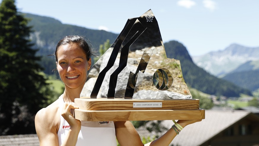Viktorija Golubic of Switzerland poses with the trophy after winning the final match against Kiki Bertens of the Netherlands, at the WTA Ladies Championship tennis tournament in Gstaad, Switzerland, s ...