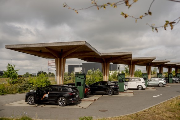 epa13072468 Electric vehicles charge at a Clever charging station along Koege Bugt Motorvejen in Koege, Denmark, 26 June 2026. The number of charging stations along major European highways has grown s ...