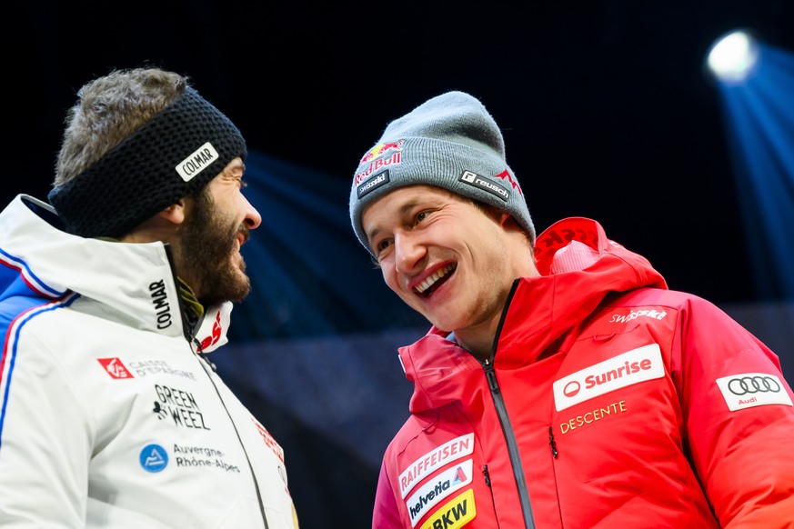 epa11074350 The winner Marco Odermatt of Switzerland reacts with second placed Cyprien Sarrazin of France during the Awards ceremony of the men&#039;s downhill race at the Alpine Skiing FIS Ski World  ...